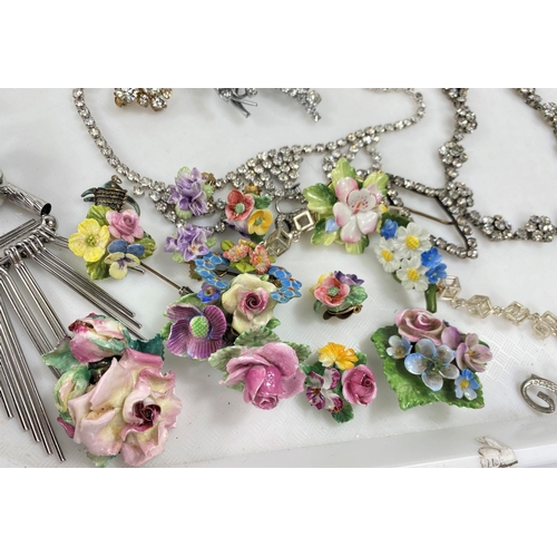 719 - A selection of vintage and costume jewellery, including diamante, floral brooches and earrings etc