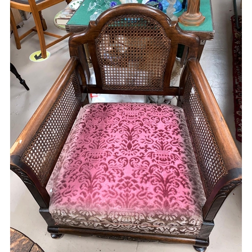 826 - An early 20th century mahogany framed bergere 2 piece suite; a similar armchair in pink