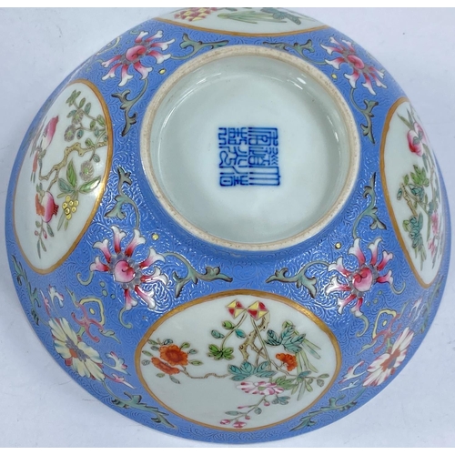 425 - A Chinese porcelain bowl with embossed enamel ground, surrounding four oval reserves decorated with ... 