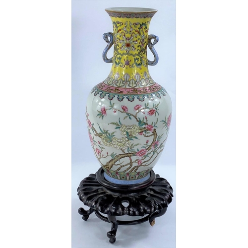 434 - A Chinese Republic period porcelain vase of baluster form, with loop handles, decorated in the Qianl... 