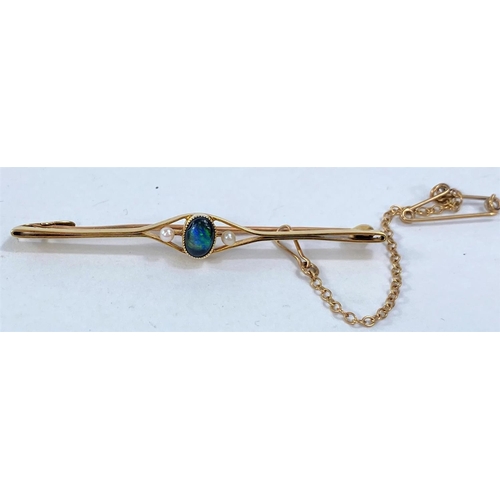 611 - A yellow metal bar brooch stamped 15ct set with central black opal and 2 seed pearls, 3gmWe will rel... 