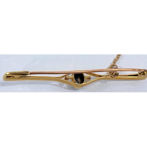 611 - A yellow metal bar brooch stamped 15ct set with central black opal and 2 seed pearls, 3gmWe will rel... 