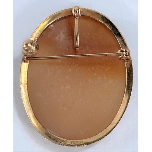 612 - A female head shell cameo brooch, the surround stamped 9kt