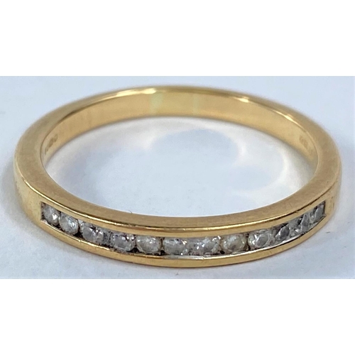 617 - A 9 carat hallmarked gold half eternity ring with 12 small diamonds in split shank setting, 2.9gm