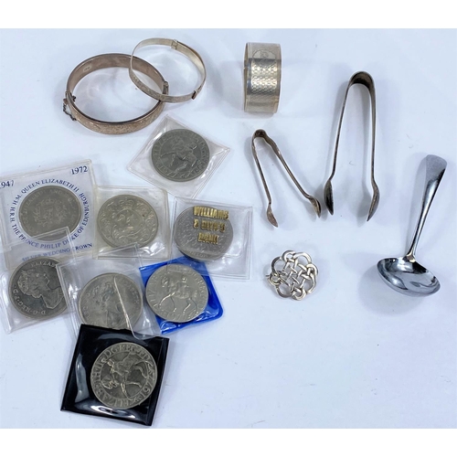 719D - A selection of hallmarked silver items including a Celtic brooch; napkin ring, 2 bracelets and a pai... 