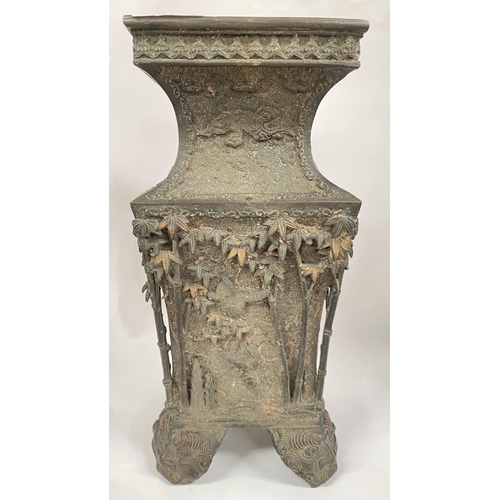 406 - A Japanese bronze vase of square form, the body with figures, bamboo, trees, birds etc in relief, th... 