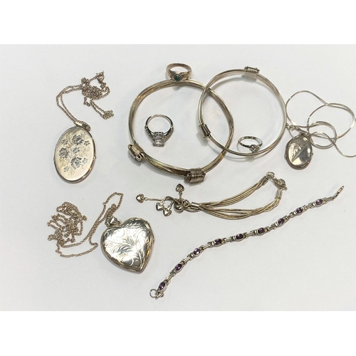 633 - A selection of white metal bracelets, rings, lockets etc