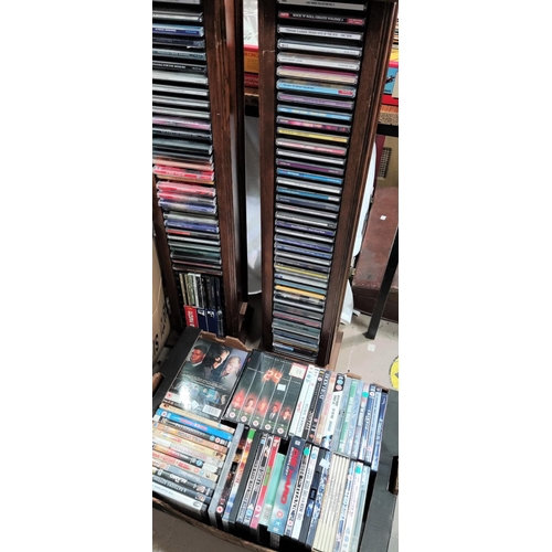 51 - 2 CD stands with CDs; a selection of DVDs, videos, boxed sets etc