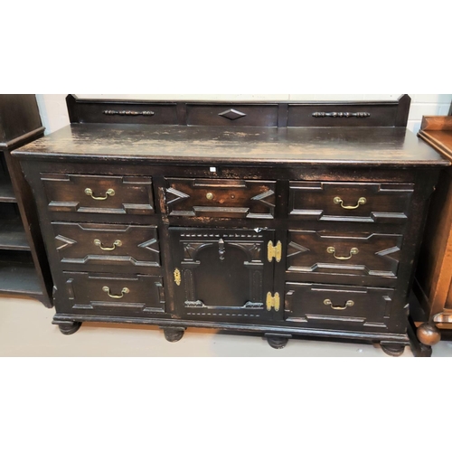 836 - A 19th century oak dresser base with geometric moulded decoration with central arched cupboard and 7... 