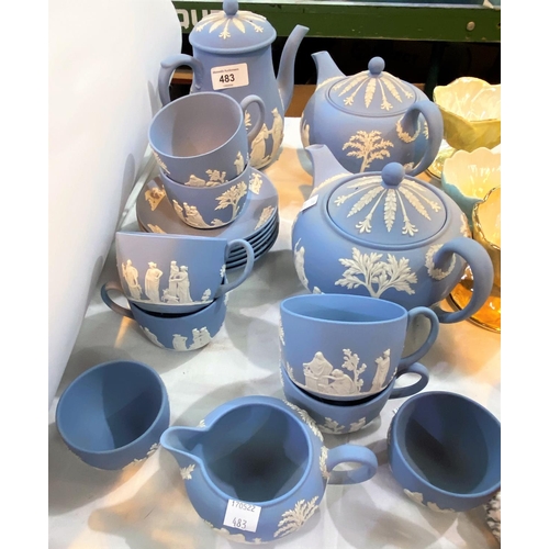 483 - A large selection of Wedgwood blue jasperware teaware:  tea and coffee pots, cups and saucers; etc.