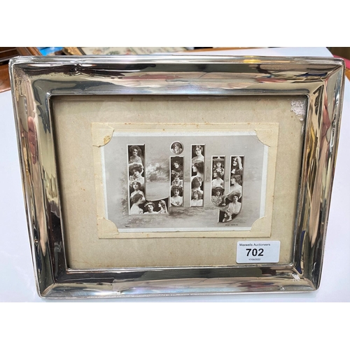 702 - A rectangular silver picture frame, Birmingham 1922, 20 x 25cm overall