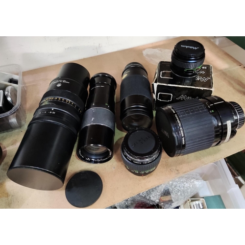 79 - A Sigma mirror-telephoto 600 mm lens; aTair-3 4.5/300A telephoto lens; a Miranda 75-300 mm macro len... 
