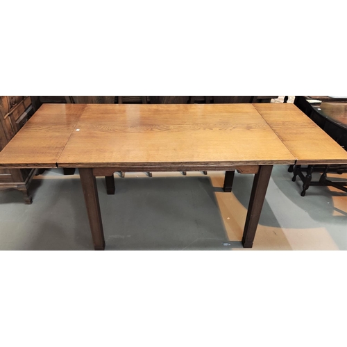 949 - A Cotswold style oak drawleaf extending dining table with square legs, sloped edges, length 123cm ex... 