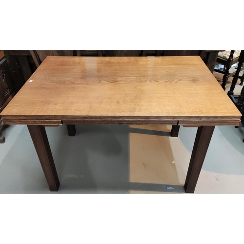 949 - A Cotswold style oak drawleaf extending dining table with square legs, sloped edges, length 123cm ex... 