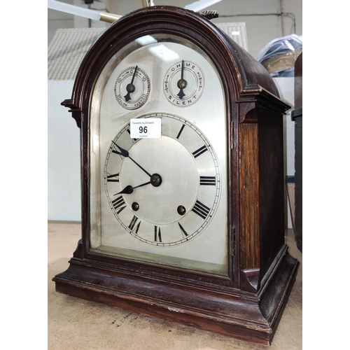 96 - An oak cased bracket clock, c. 1900, silvered dial, domed top with carry handle, key and pendulum