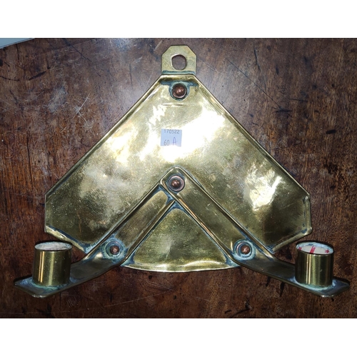 60A - An Arts and Crafts brass and copper double candle wall sconce length 25cm