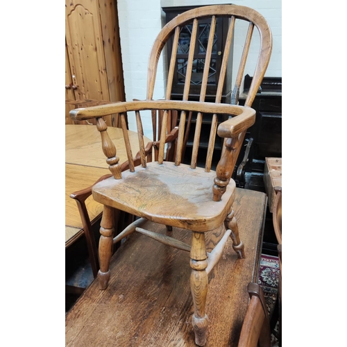843 - A child's elm Windsor armchair; 2 other chairs; 2 stools