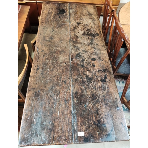 890 - A 17th/18th century plank top refectory table on square chamfered legs160cm length x 70cm wide x 78c... 