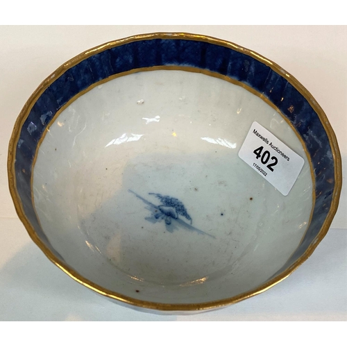402 - A 19th century export blue and white bowl with ribbed exterior and gilt rim, diameter 14cm