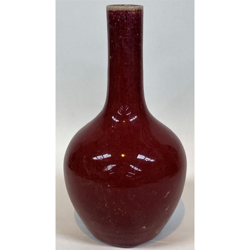 411 - A Chinese sang de boeuf glazed stoneware bottle vase, height 22cm