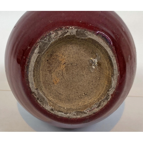411 - A Chinese sang de boeuf glazed stoneware bottle vase, height 22cm