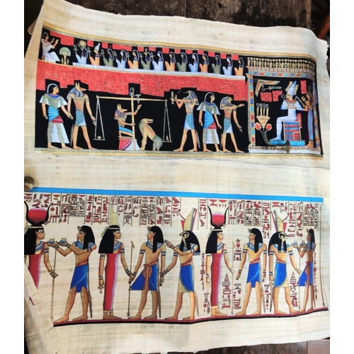 73 - A pair of Egyptian gouache paintings on papyrus, 43 x 85 cm; and another, 63 x 92 cm, mid 20th centu... 