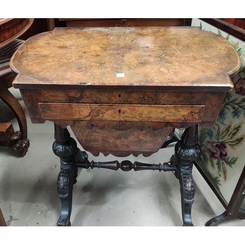 840 - A Victorian quarter veneered walnut worktable with hinged rounded rectangular top, writing slide and... 