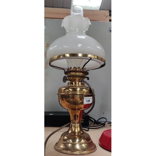 146 - An oil lamp with brass reservoirNo bids sold with next lot