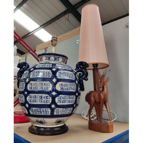 149b - A large blue and white baluster lamp base and a carved antelope lamp