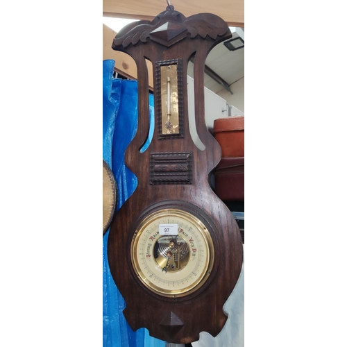 97 - An early 20th century barometer with thermometer in oak case