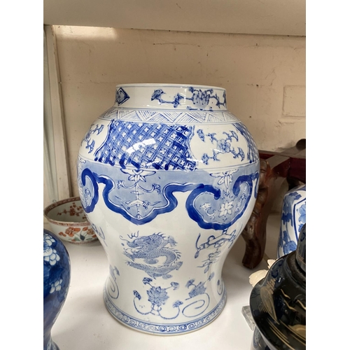 405 - A modern Chinese blue and white vase of inverted baluster form; a covered vase; a bamboo brush pot; ... 