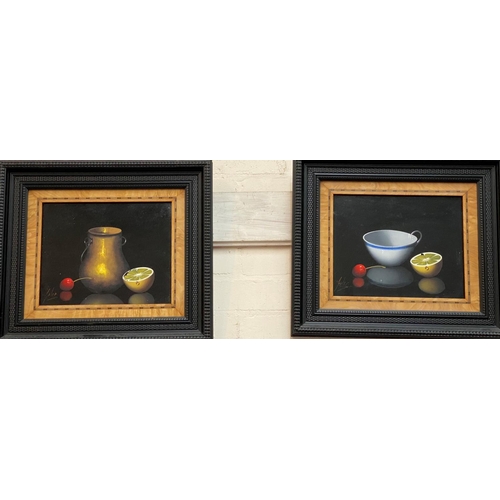 791A - A 20th century still life of 1/2 a lemon, cherry & a vase/cup, a pair of oils on board, signed&n... 