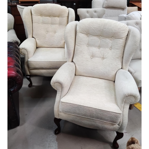 889 - A pair of modern wing back armchairs in cream upholstery on cabriole legs by Sherbourne