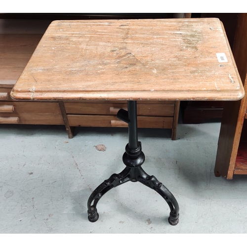 898 - A pine top occasional table on cast iron pedestal base
