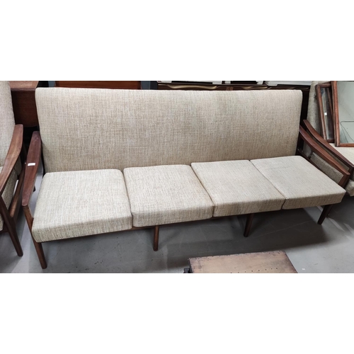 918 - A 1960's teak 4 seater settee by Guy Rogers, upholstered in oatmeal fabric