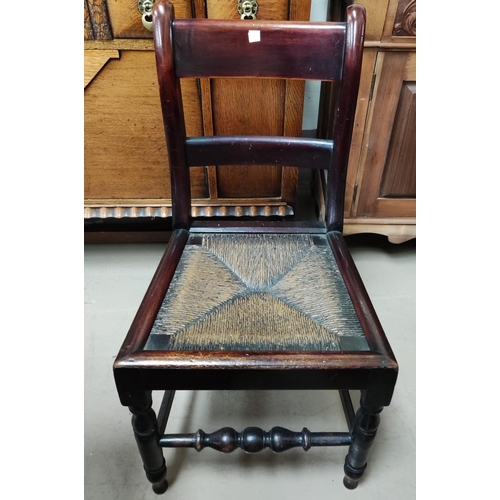 825A - A 1930's drop leaf dining table; a Lancashire spindle back dining chair and three 19th century ladde... 