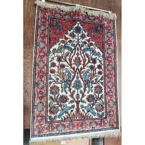 858 - A Middle Eastern hand worn prayer rug.