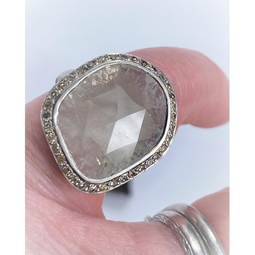 707 - By William Welstead, English jewellery designer, an 18 carat hallmarked white gold ring set with lar... 