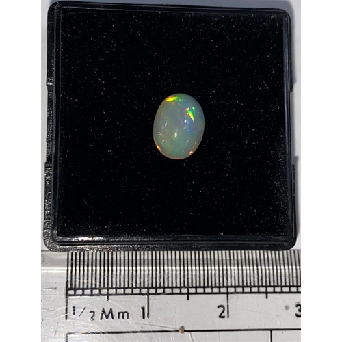 717B - An oval cabochon cut opal, 0.87 carat