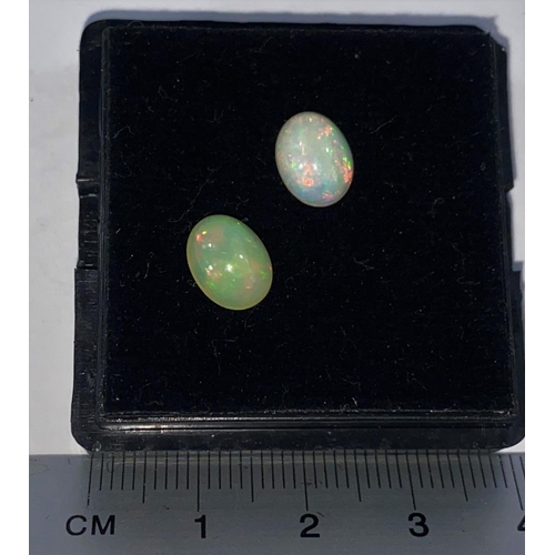718D - Two cabochon cut opals, 2.38 carats
