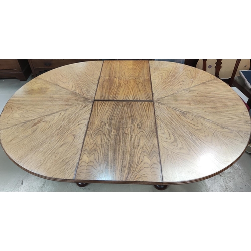 956 - A mid 20th century oriental hardwood dining suite, comprising: a circular extending dining table on ... 