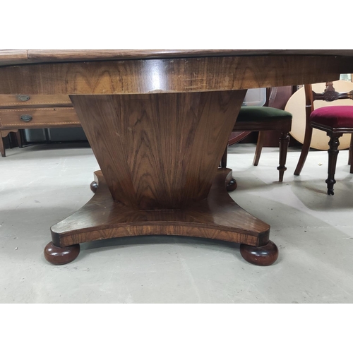 956 - A mid 20th century oriental hardwood dining suite, comprising: a circular extending dining table on ... 