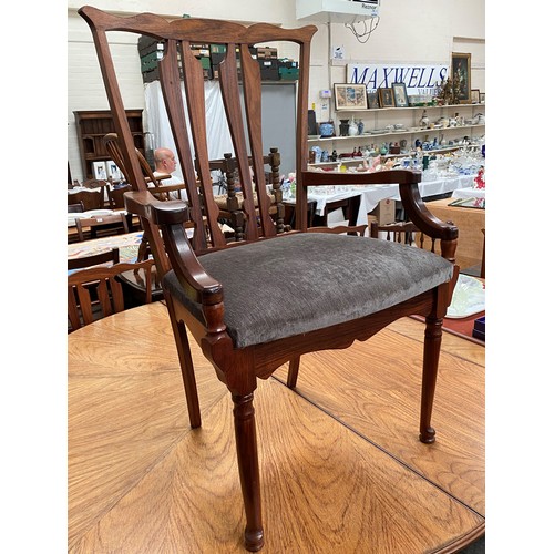 956 - A mid 20th century oriental hardwood dining suite, comprising: a circular extending dining table on ... 