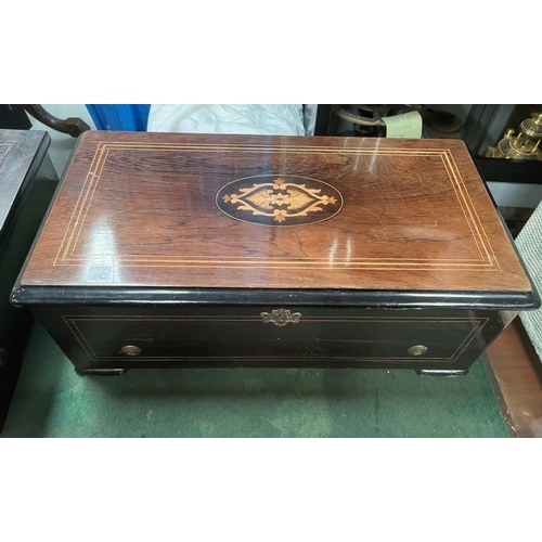 100C - An inlaid rosewood music box with single cylinder, two teeth present, Length 46cm