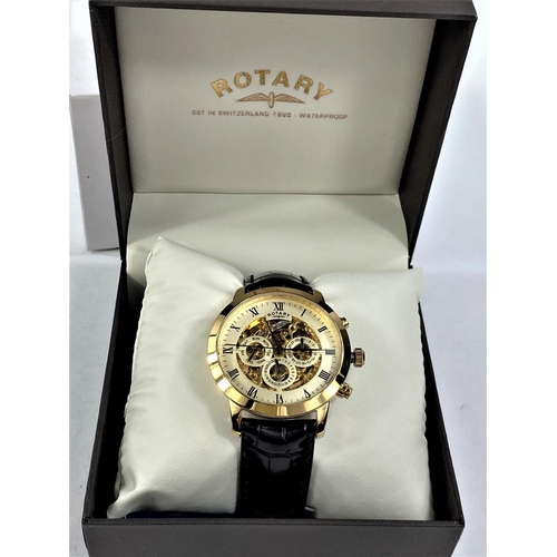 712 - A boxed gent's automatic Rotary wristwatch with instructions on leather effect strap, skeleton face
