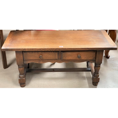821 - An oak 2 tier coffee table with rectangular top and 2 frieze drawers, on turned legs