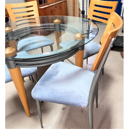 939 - A circular glass top breakfast/kitchen table and four modern chairs