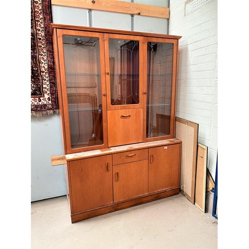 951 - A 20th century teak G-Plan sideboard with three cupboards and single drawer, length 132cm