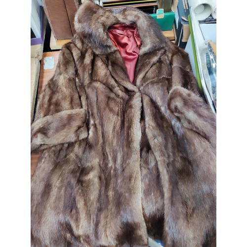 15B - A full length brown fur coat, another faux fur coat and a selection of lace and linen etc
