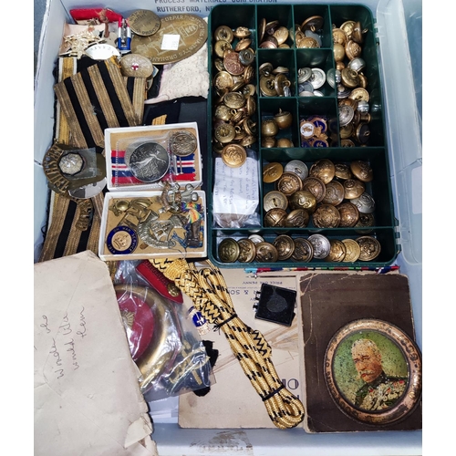 238 - A group of military collectables to include medals, badges and buttons; a collection of naval cloth ... 